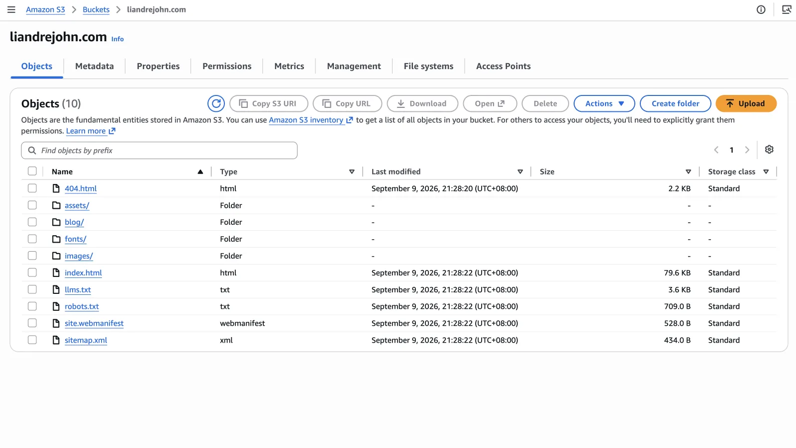 The Amazon S3 console for the liandrejohn.com bucket, listing the deployed site: 404.html and index.html, folders for assets, blog, fonts and images, plus llms.txt, robots.txt, site.webmanifest and sitemap.xml.